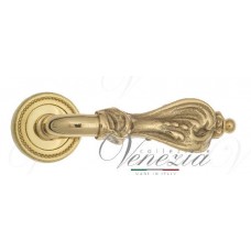 Ручка дверная на круглой розетке Venezia Florence D3 Латунь блестящая