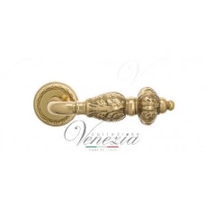 Ручка дверная на круглой розетке Venezia Lucrecia D2 Латунь блестящая
