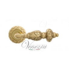 Ручка дверная на круглой розетке Venezia Lucrecia D4 Латунь блестящая